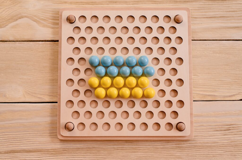Children's educational wooden game. The study of colors. Montessori concept, early brain training.